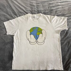 Her Universe White Tee with Earth Held by Cartoon Gloves